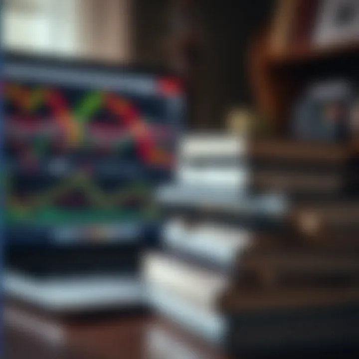 Stack of forex trading books with a laptop and financial graphs on screen