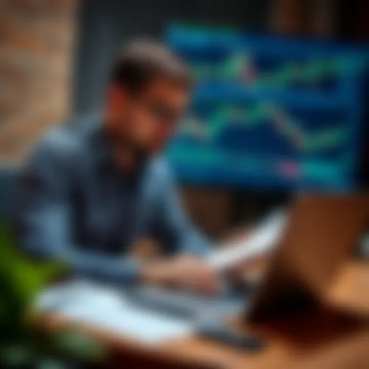 Individual reviewing trading strategies and notes with laptop and financial charts